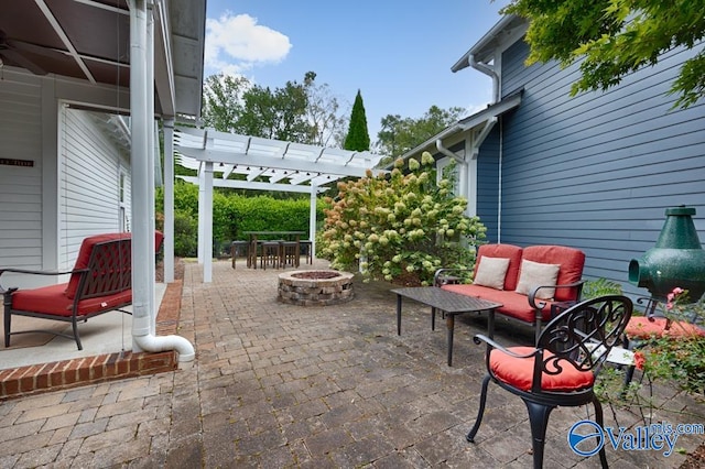 view of patio / terrace featuring a pergola and a fire pit