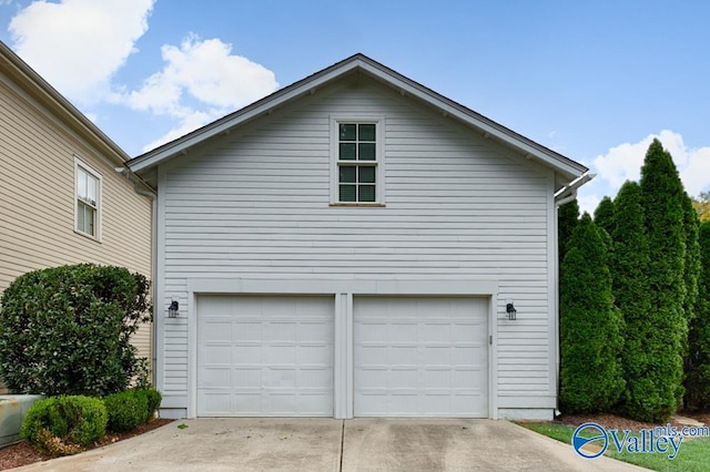 view of property exterior featuring a garage