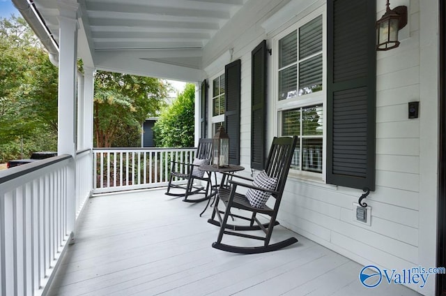 wooden terrace featuring a porch