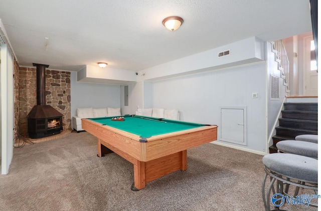 playroom with a wood stove, visible vents, carpet flooring, and pool table