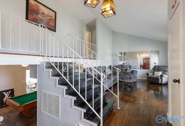 stairway with high vaulted ceiling, pool table, visible vents, and wood finished floors