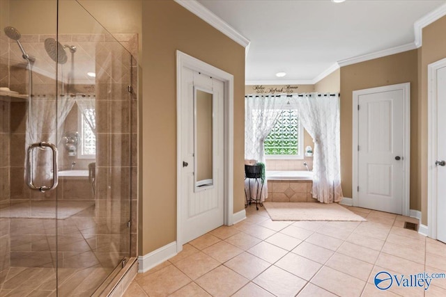 1081 County Road 190, Moulton, AL 35650 - bathroom featuring a garden tub, a stall shower, ornamental molding, baseboards, and tile patterned flooring