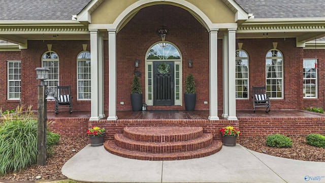 1081 County Road 190, Moulton, AL 35650 - entrance to property with a porch, a shingled roof, and brick siding