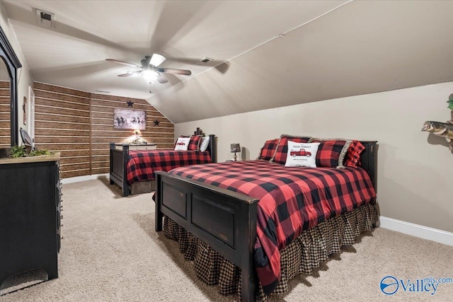 1081 County Road 190, Moulton, AL 35650 - bedroom featuring light colored carpet, wood walls, vaulted ceiling, baseboards, and a ceiling fan