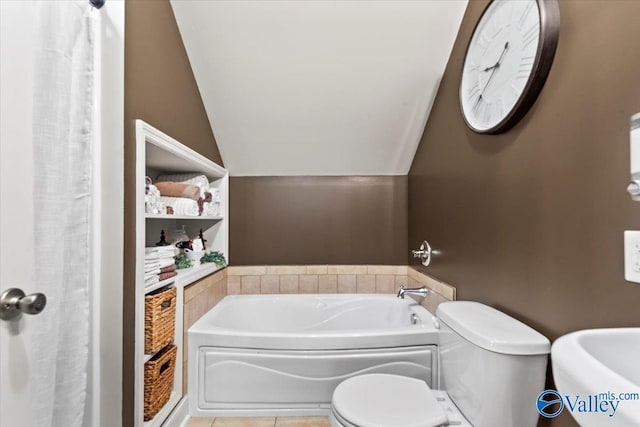 1081 County Road 190, Moulton, AL 35650 - bathroom with vaulted ceiling, toilet, a garden tub, tile patterned flooring, and a sink