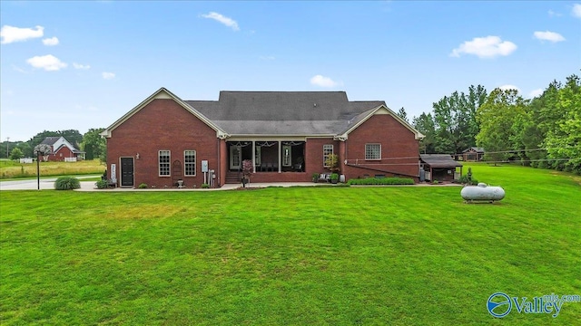 1081 County Road 190, Moulton, AL 35650 - rear view of house featuring brick siding and a yard