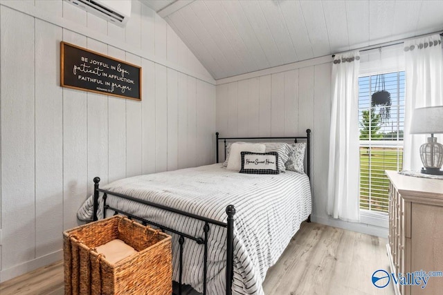 1081 County Road 190, Moulton, AL 35650 - bedroom with wood finished floors, vaulted ceiling, and wooden walls