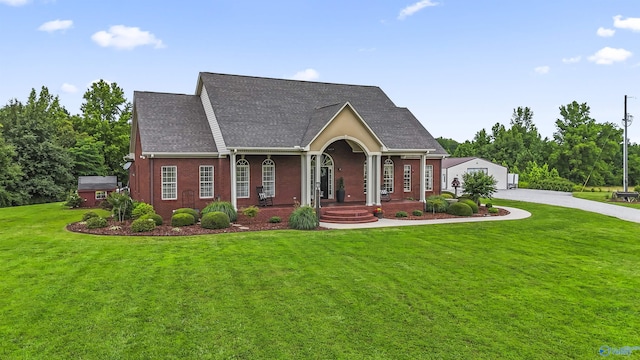 1081 County Road 190, Moulton, AL 35650 - view of front of home featuring a front lawn, covered porch, and roof with shingles