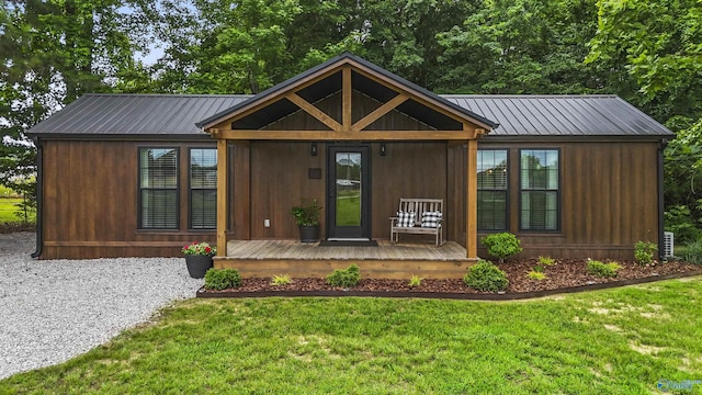 1081 County Road 190, Moulton, AL 35650 - view of front facade with metal roof, a front lawn, and a porch