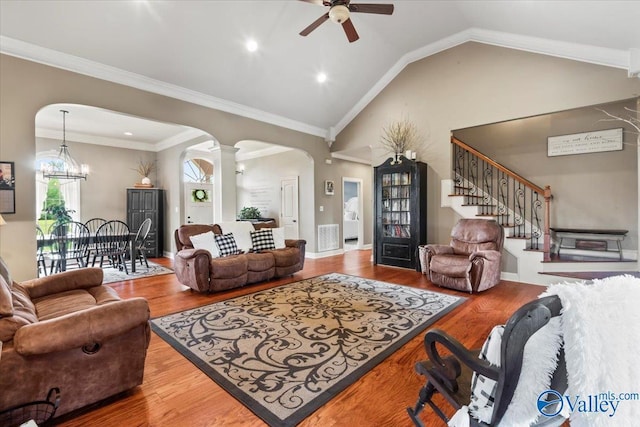 1081 County Road 190, Moulton, AL 35650 - living area featuring arched walkways, a ceiling fan, ornate columns, stairway, and vaulted ceiling
