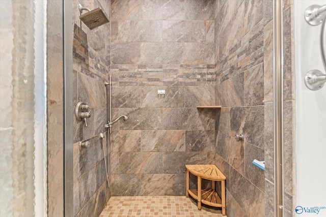 bathroom with a tile shower