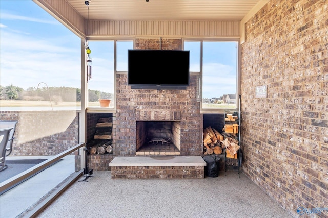 view of patio / terrace featuring an outdoor brick fireplace