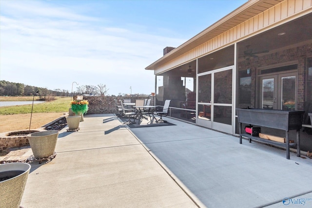 view of patio with a sunroom