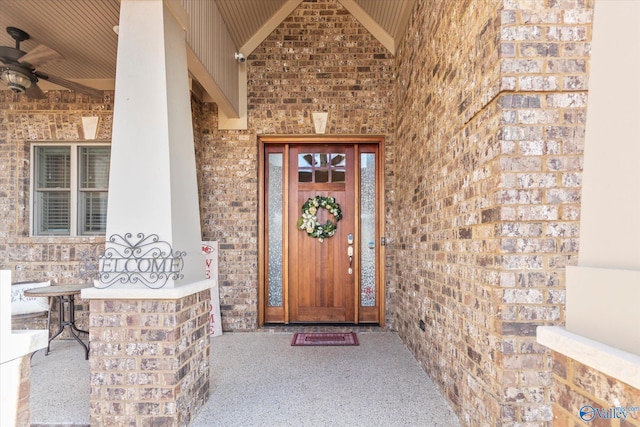 doorway to property with ceiling fan