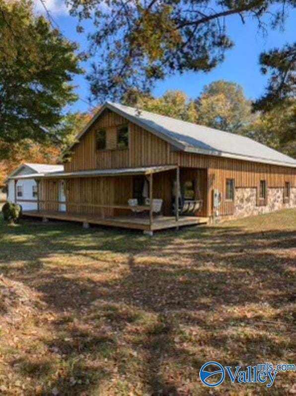 back of house featuring a deck