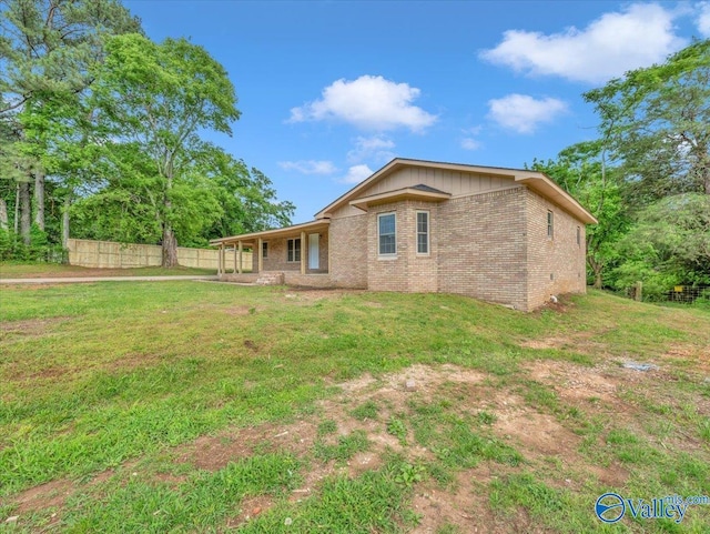 1492 County Road 314, Town Creek, AL 35672 - back of house featuring brick siding