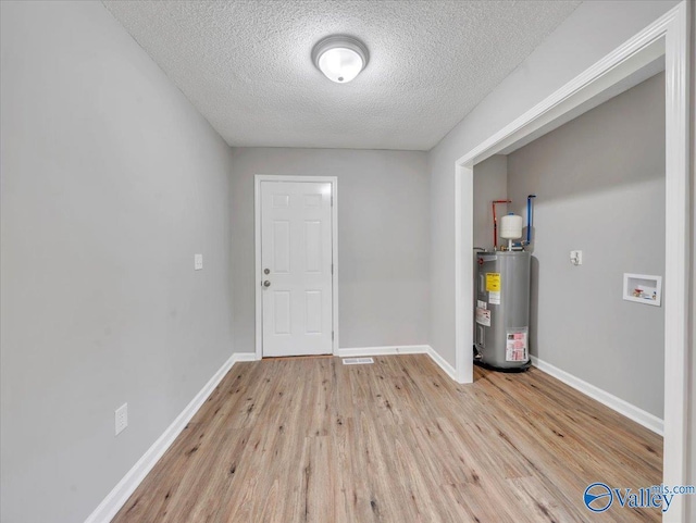 1492 County Road 314, Town Creek, AL 35672 - utility room featuring water heater