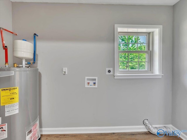 1492 County Road 314, Town Creek, AL 35672 - washroom featuring electric water heater, hookup for an electric dryer, wood finished floors, and baseboards
