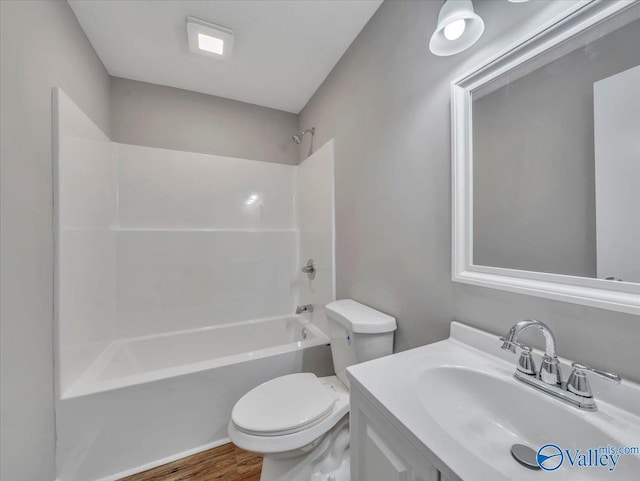 1492 County Road 314, Town Creek, AL 35672 - full bath with toilet, washtub / shower combination, vanity, and wood finished floors