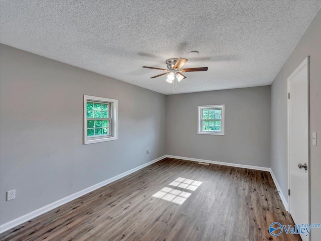 1492 County Road 314, Town Creek, AL 35672 - unfurnished room featuring ceiling fan, baseboards, wood finished floors, and a textured ceiling