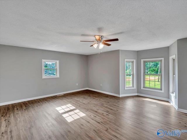 1492 County Road 314, Town Creek, AL 35672 - unfurnished room with a ceiling fan, wood finished floors, baseboards, and a textured ceiling