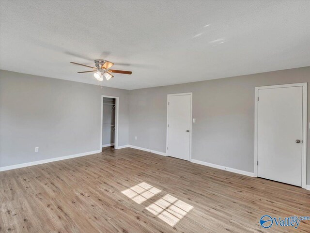 1492 County Road 314, Town Creek, AL 35672 - spare room featuring wood finished floors, a ceiling fan, baseboards, and a textured ceiling