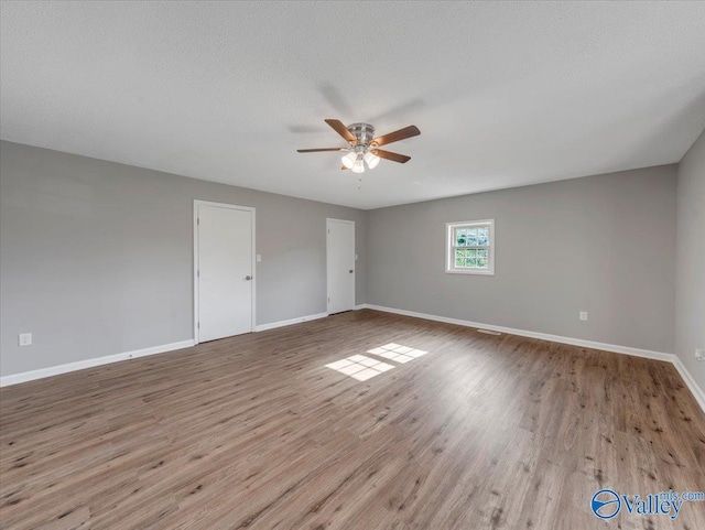 1492 County Road 314, Town Creek, AL 35672 - empty room featuring ceiling fan, baseboards, and wood finished floors