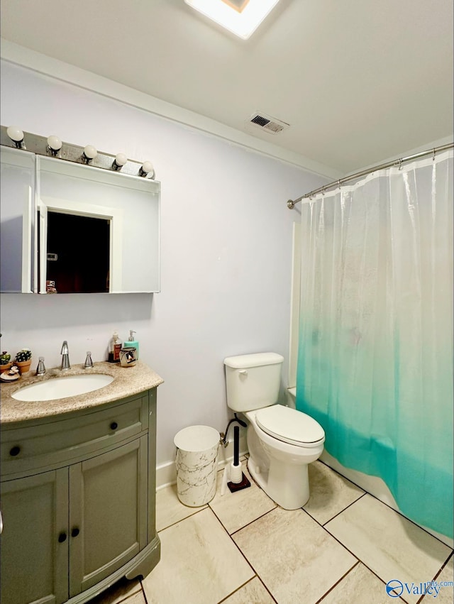 full bathroom with shower / bath combination with curtain, vanity, tile patterned flooring, and toilet