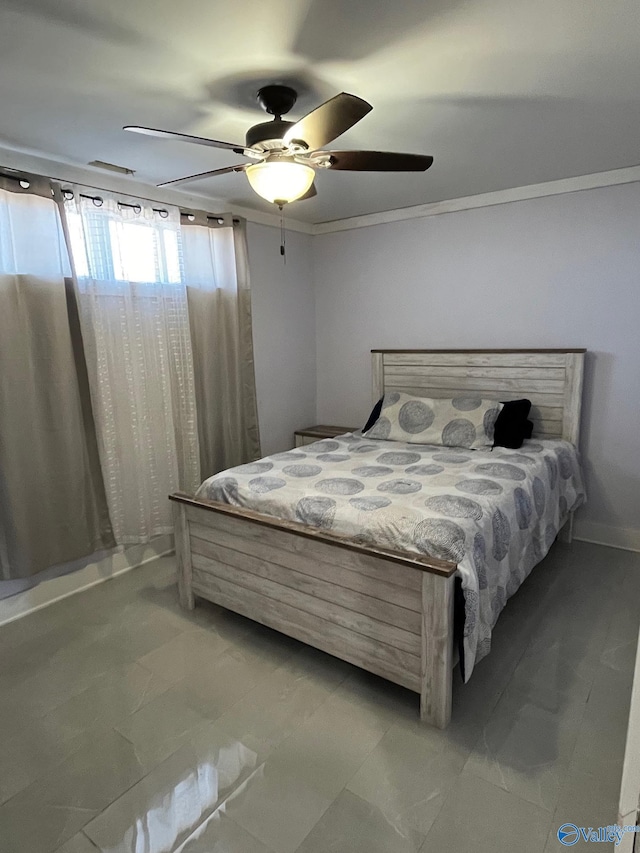 bedroom with ceiling fan and crown molding