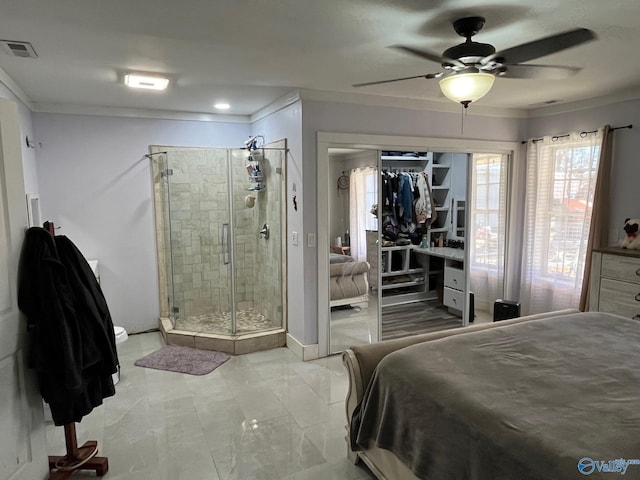 bedroom featuring ornamental molding, a closet, and ceiling fan