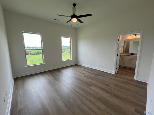 unfurnished room with hardwood / wood-style flooring, sink, and ceiling fan