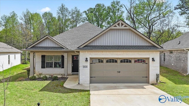 1820 Anise Cir SE, Cullman, AL 35055 - view of front facade with board and batten siding, a garage, a front lawn, driveway, and roof with shingles