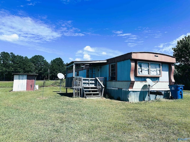 exterior space featuring a storage unit and a front lawn