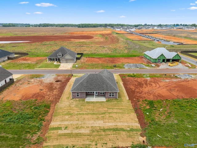 birds eye view of property with a rural view
