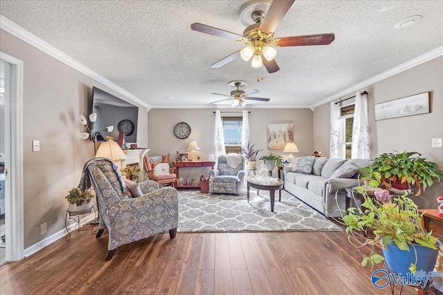 living room with ornamental molding, a textured ceiling, hardwood / wood-style flooring, and ceiling fan