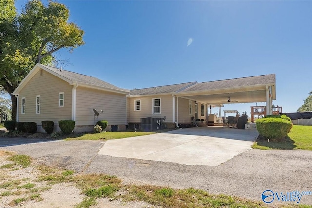 view of front of home featuring central air condition unit, a patio, and ceiling fan