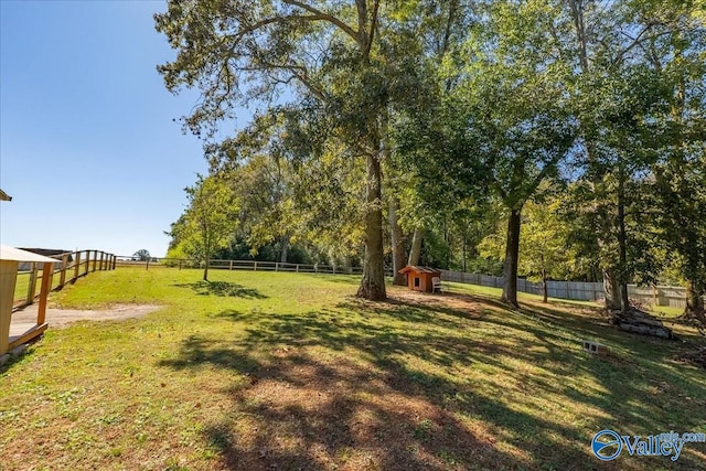 view of yard with a rural view