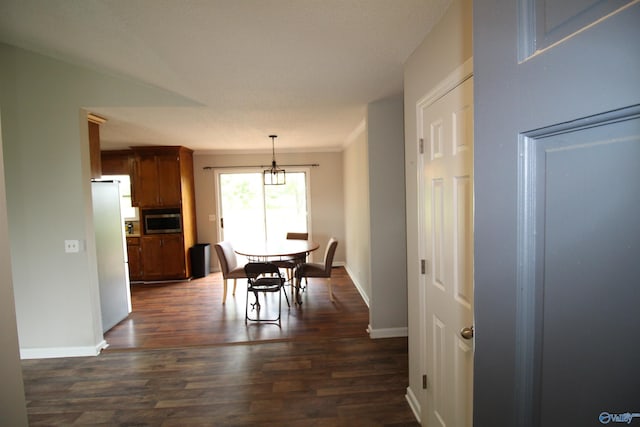 115 Kathleen Dr, Hazel Green, AL 35750 - dining area featuring a chandelier, dark wood-type flooring, baseboards, and crown molding