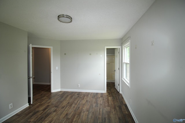 115 Kathleen Dr, Hazel Green, AL 35750 - spare room with dark wood finished floors, baseboards, and a textured ceiling