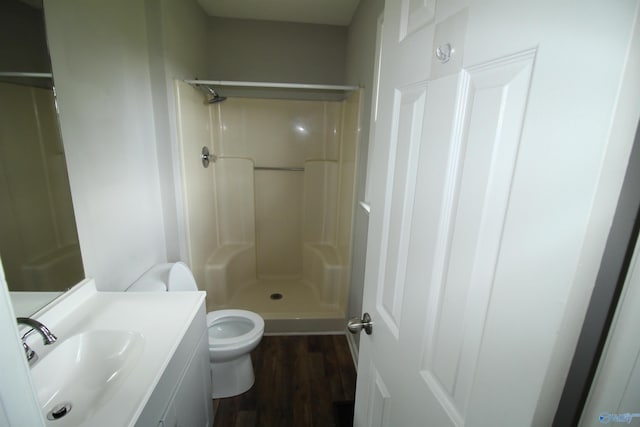 115 Kathleen Dr, Hazel Green, AL 35750 - bathroom with toilet, wood finished floors, a shower, and vanity