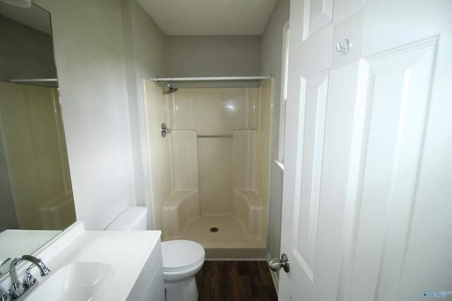115 Kathleen Dr, Hazel Green, AL 35750 - full bath featuring toilet, a shower, wood finished floors, and vanity