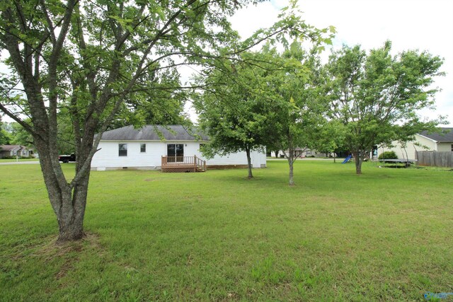 115 Kathleen Dr, Hazel Green, AL 35750 - view of grassy yard featuring a deck