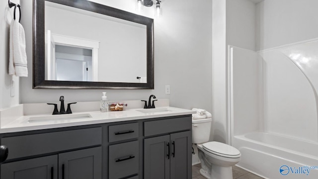 full bathroom with vanity, toilet, tile patterned floors, and shower / washtub combination