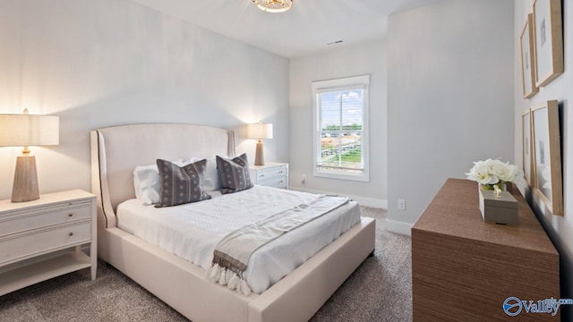 bedroom featuring dark carpet