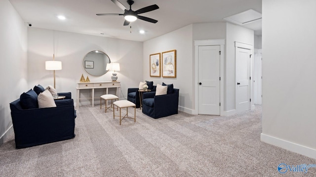 living room with ceiling fan and carpet floors