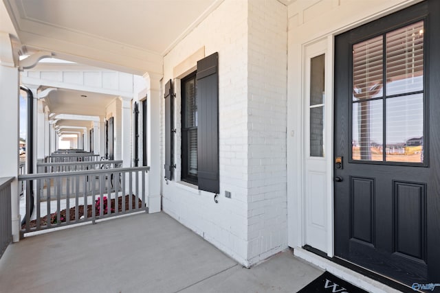 doorway to property featuring covered porch