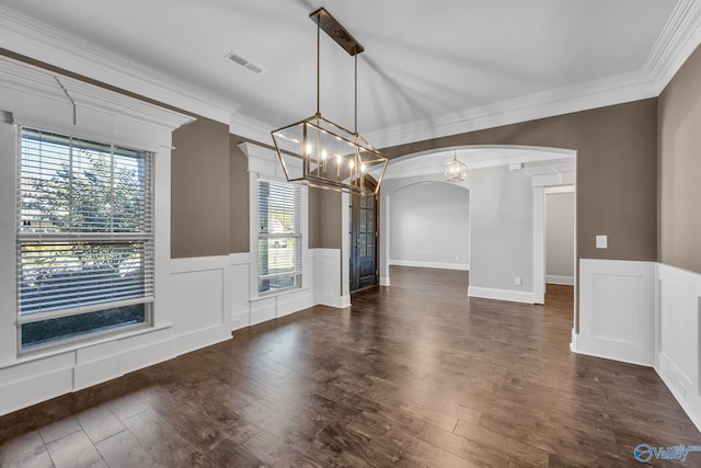 unfurnished dining area featuring dark wood-type flooring and ornamental molding