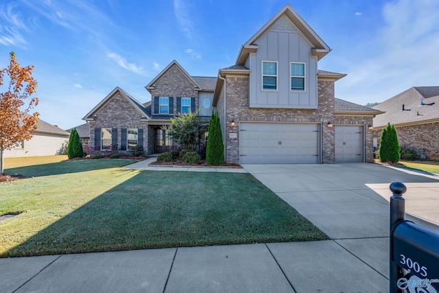 view of front of property featuring a front lawn and a garage