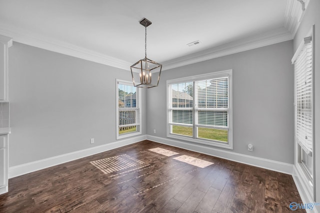 unfurnished dining area with ornamental molding, a chandelier, and dark hardwood / wood-style floors