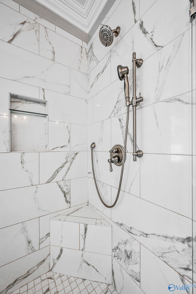 details with crown molding and tiled shower